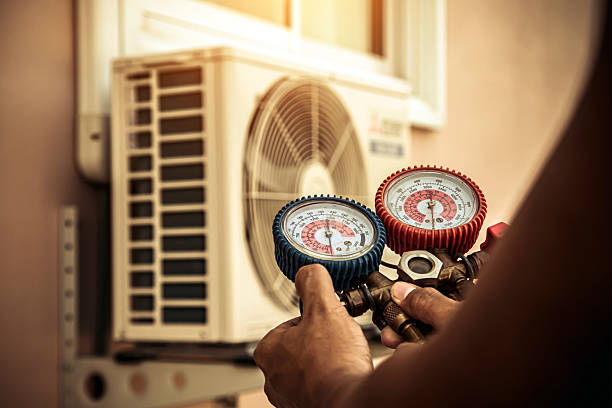 Professional Air Conditioning Service technician working in Chichester, NY